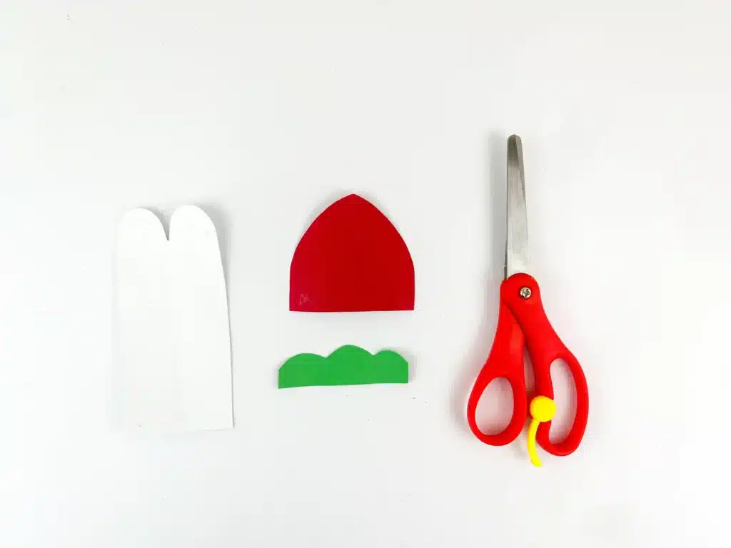 Penguin Ornament Craft - Cultivating Brilliant Minds penguin pieces cut out of construction paper