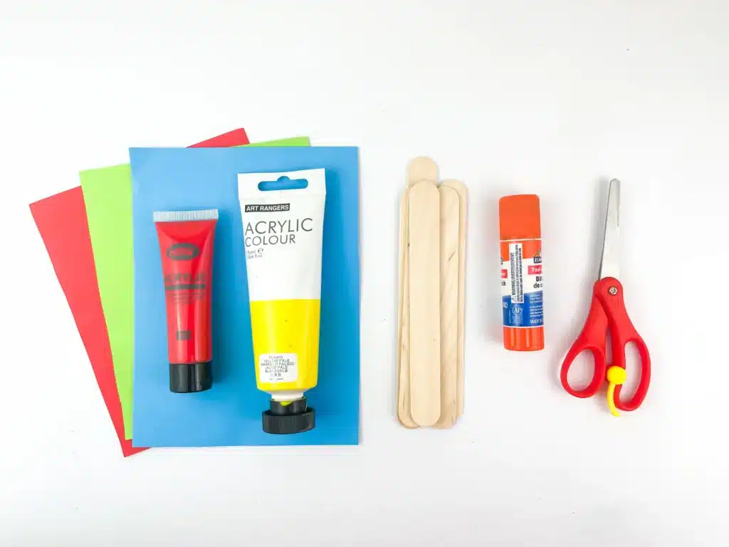 Santa Sleigh Craft - Cultivating Brilliant Minds colored construction paper, red and yellow paint, popsicle sticks, glue, and scissors