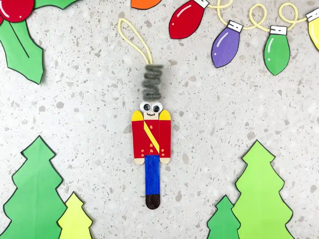 popsicle sticks decorated to look like a nutcracker