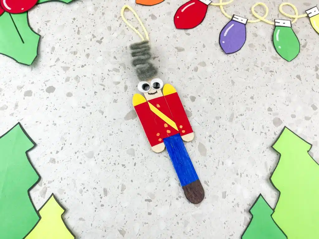 popsicle sticks decorated to look like a nutcracker