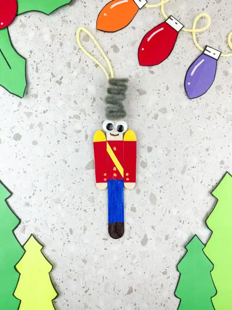 popsicle sticks decorated to look like a nutcracker
