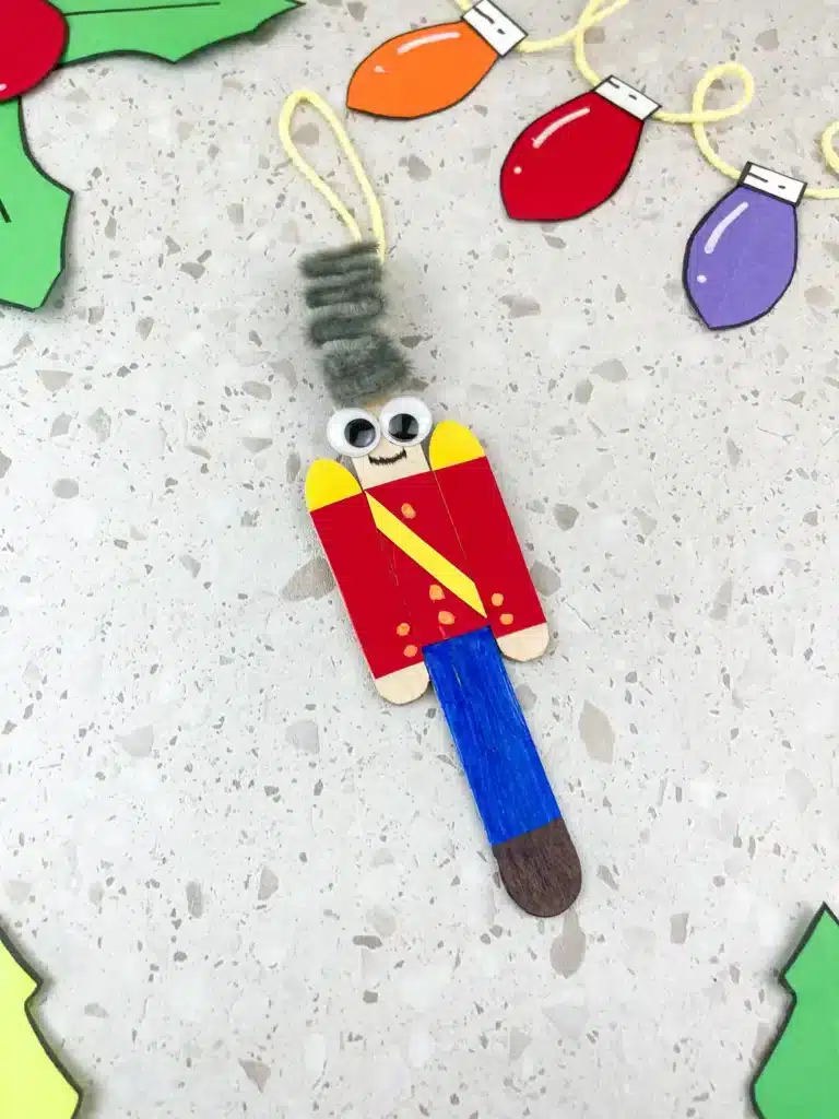 popsicle sticks decorated to look like a nutcracker