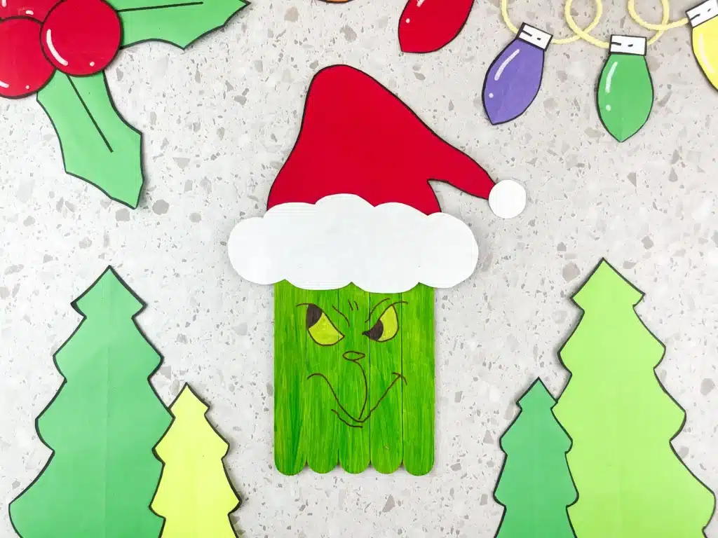 Grinch Popsicle Stick Craft - Cultivating Brilliant Minds popsicle sticks colored to look like the grinch