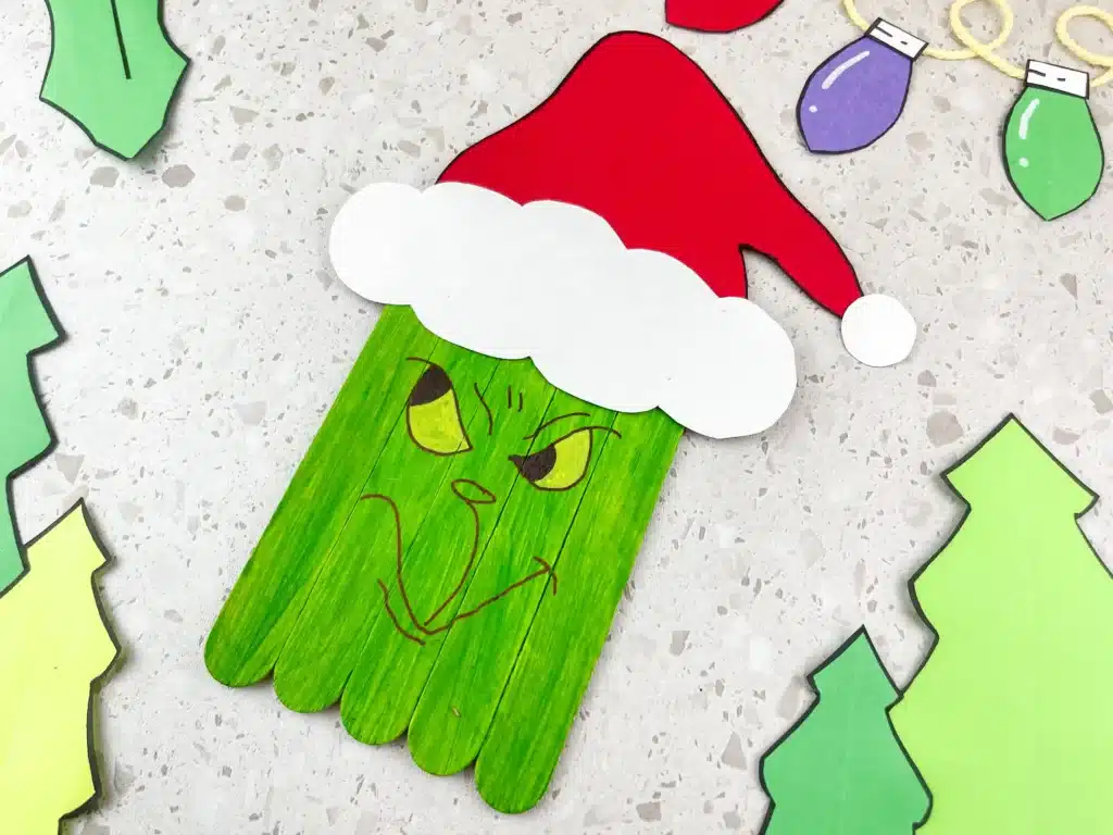 Grinch Popsicle Stick Craft - Cultivating Brilliant Minds popsicle sticks colored to look like the grinch