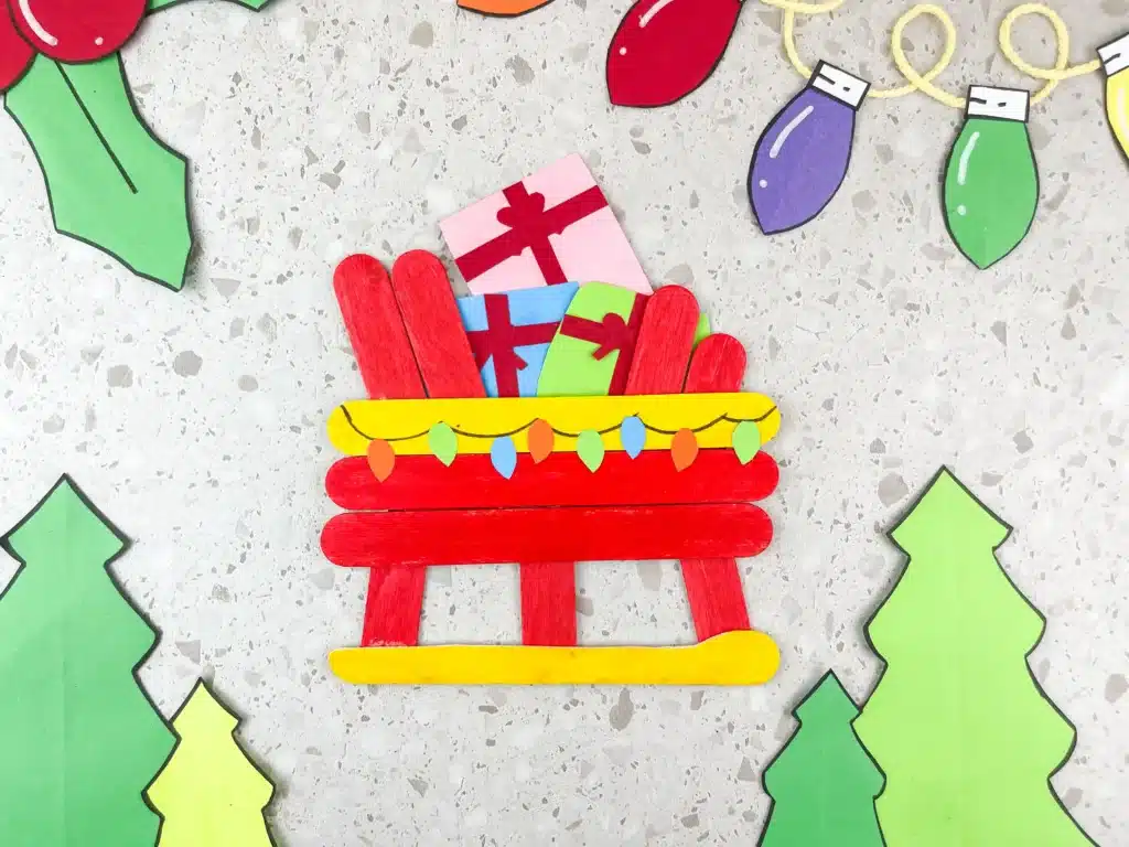 Santa Sleigh Craft - Cultivating Brilliant Minds a santa sleigh craft made out of popsicle sticks