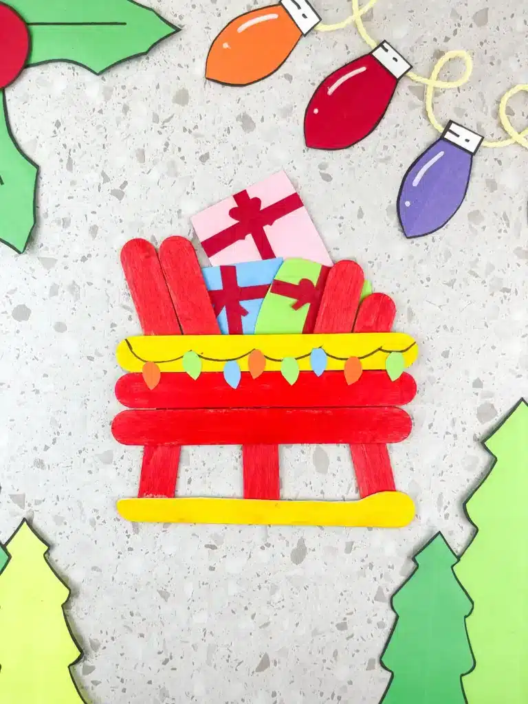 Santa Sleigh Craft - Cultivating Brilliant Minds a santa sleigh craft made out of popsicle sticks