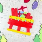 Santa Sleigh Craft - Cultivating Brilliant Minds a santa sleigh craft made out of popsicle sticks