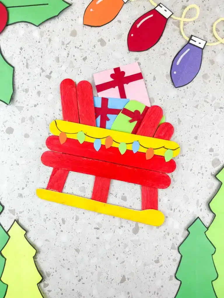Santa Sleigh Craft - Cultivating Brilliant Minds a santa sleigh craft made out of popsicle sticks
