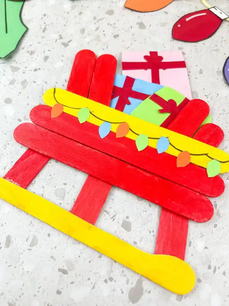 Santa Sleigh Craft - Cultivating Brilliant Minds a santa sleigh craft made out of popsicle sticks