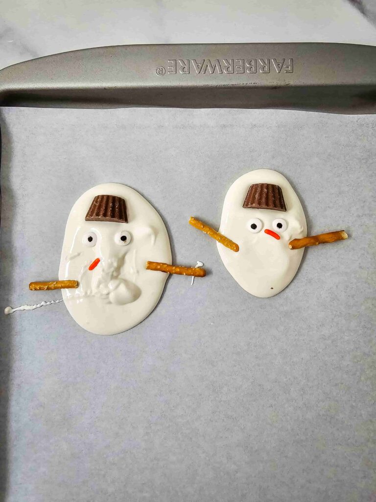 Melted Snowman Chocolate Bark - Cultivating Brilliant Minds White chocolate bark decorated to look like melted snowmen