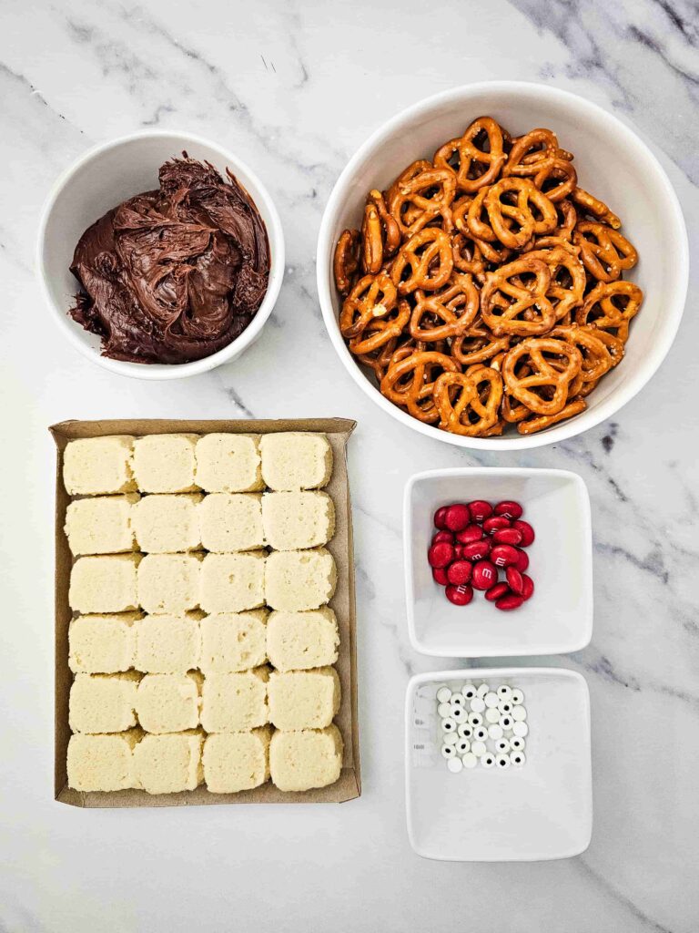 Reindeer Sugar Cookies - Cultivating Brilliant Minds pretzels, red m&ms, chocolate icing, candy eyes, and cookie mix