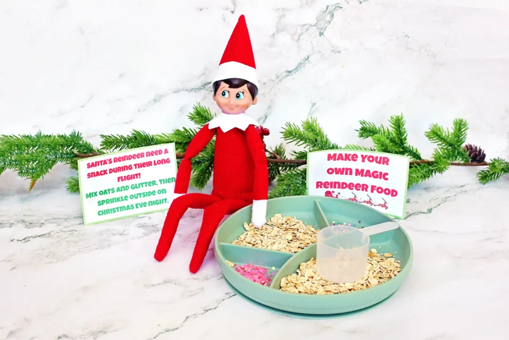 Elf on the Shelf Reindeer Food Craft - Cultivating Brilliant Minds elf on the shelf next to a tray of oats and glitter with a sign that reads make your own reindeer food"