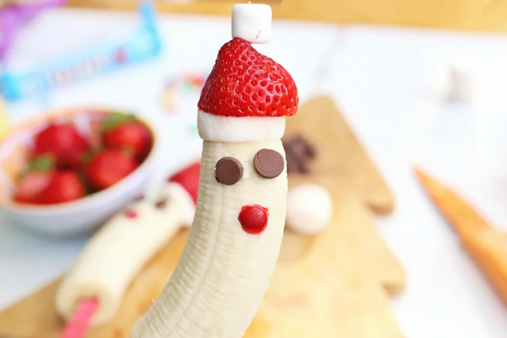 Banana Santa: A Healthy Christmas Snack - Cultivating Brilliant Minds bananas with strawberry hats made to look like Santa