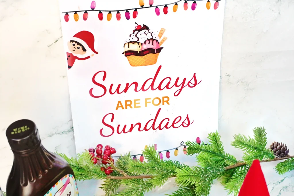 Elf on the Shelf Idea - Cultivating Brilliant Minds a sign that reads "sundays are for sundaes" with a picture of an elf on the shelf