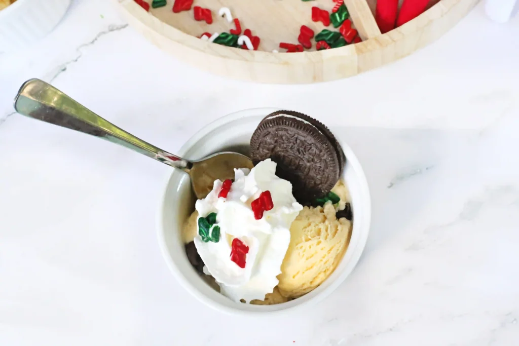 Elf on the Shelf Idea - Cultivating Brilliant Minds a bowl of ice cream with toppings