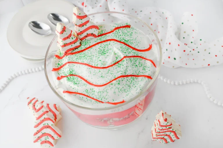 a christmas tree trifle in a glass trifle jar