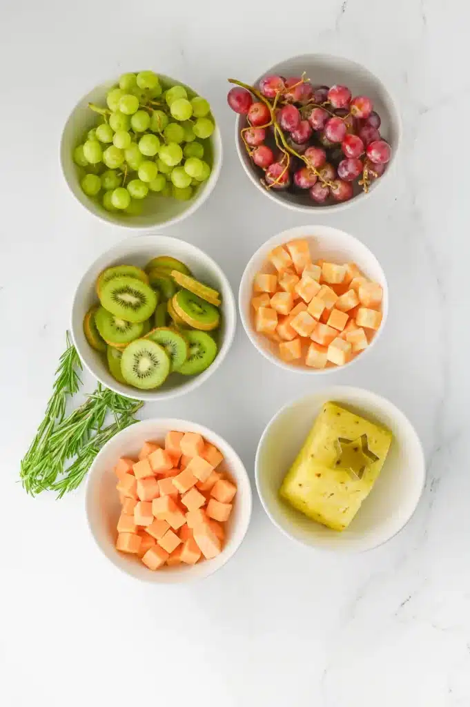 Christmas Tree Fruit Tray - Cultivating Brilliant Minds different fruits and cheeses in bowls