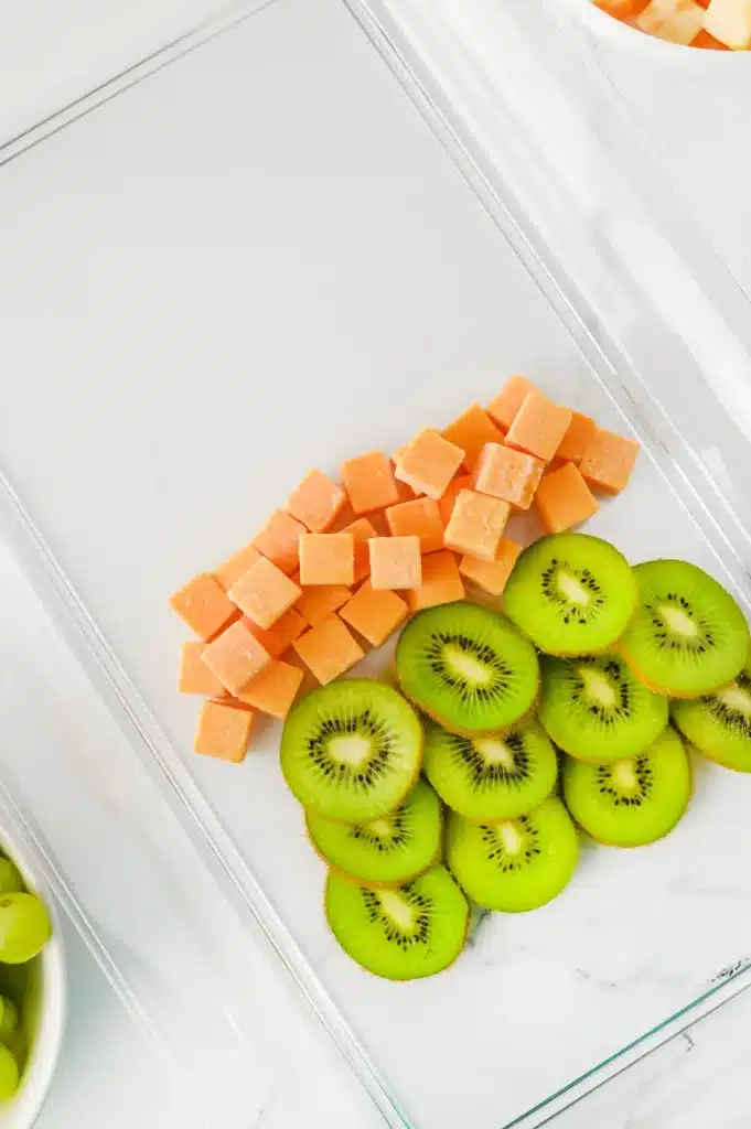 Christmas Tree Fruit Tray - Cultivating Brilliant Minds kiwi and cheese on a tray