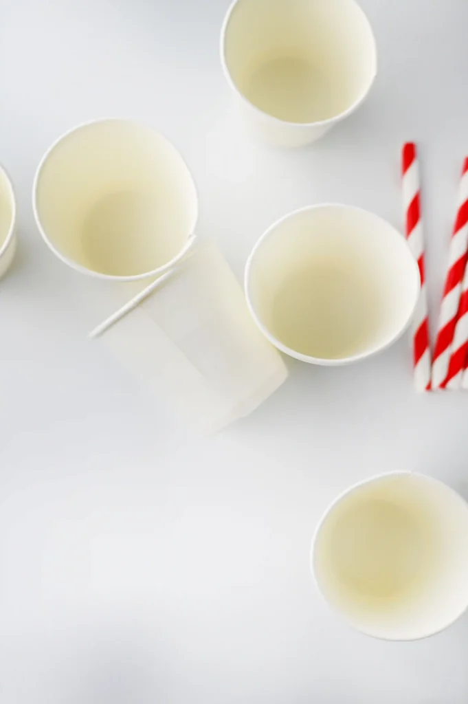 Hot Chocolate Sticks - Cultivating Brilliant Minds paper cups and red and white striped straws