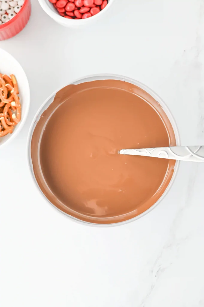 Reindeer Bark for Christmas - Cultivating Brilliant Minds melted chocolate in a bowl