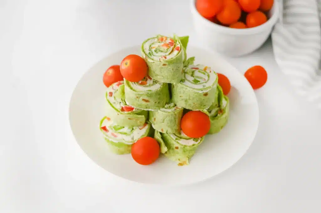 Christmas Pinwheels - Cultivating Brilliant Minds christmas pinwheels decorated with cherry tomatoes