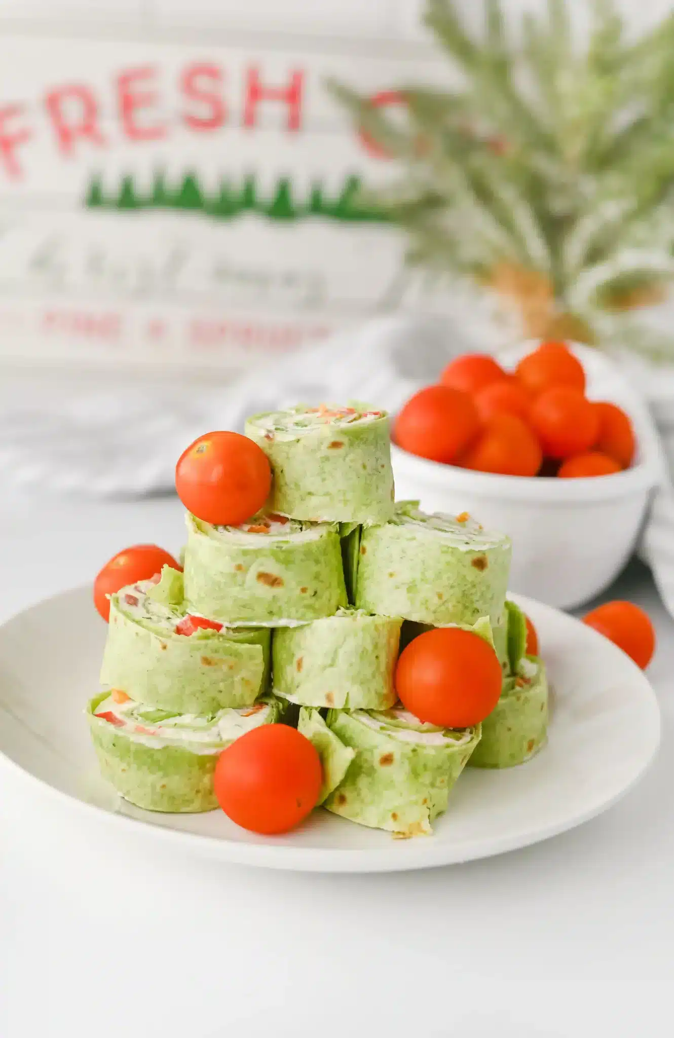 Christmas Pinwheels - Cultivating Brilliant Minds christmas pinwheels decorated with cherry tomatoes
