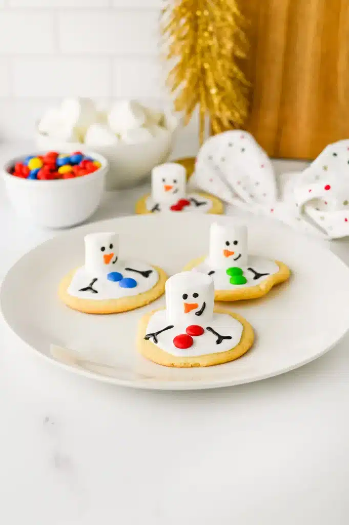 Melted Snowman Cookies - Cultivating Brilliant Minds cookies decorated to look like melted snowmen