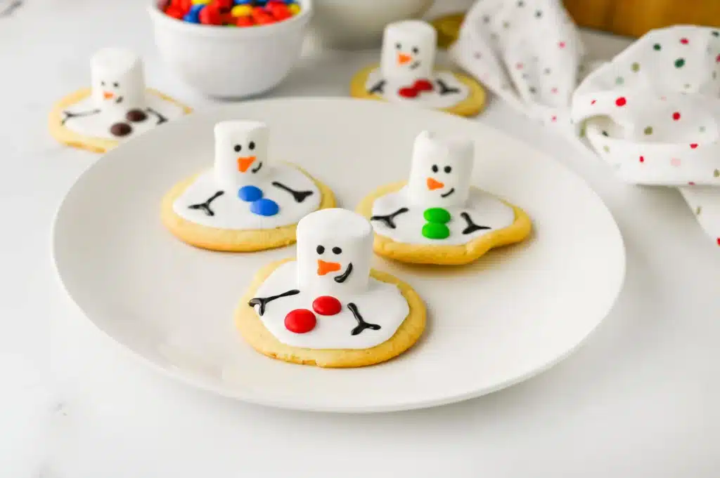 Melted Snowman Cookies - Cultivating Brilliant Minds cookies decorated to look like melted snowmen
