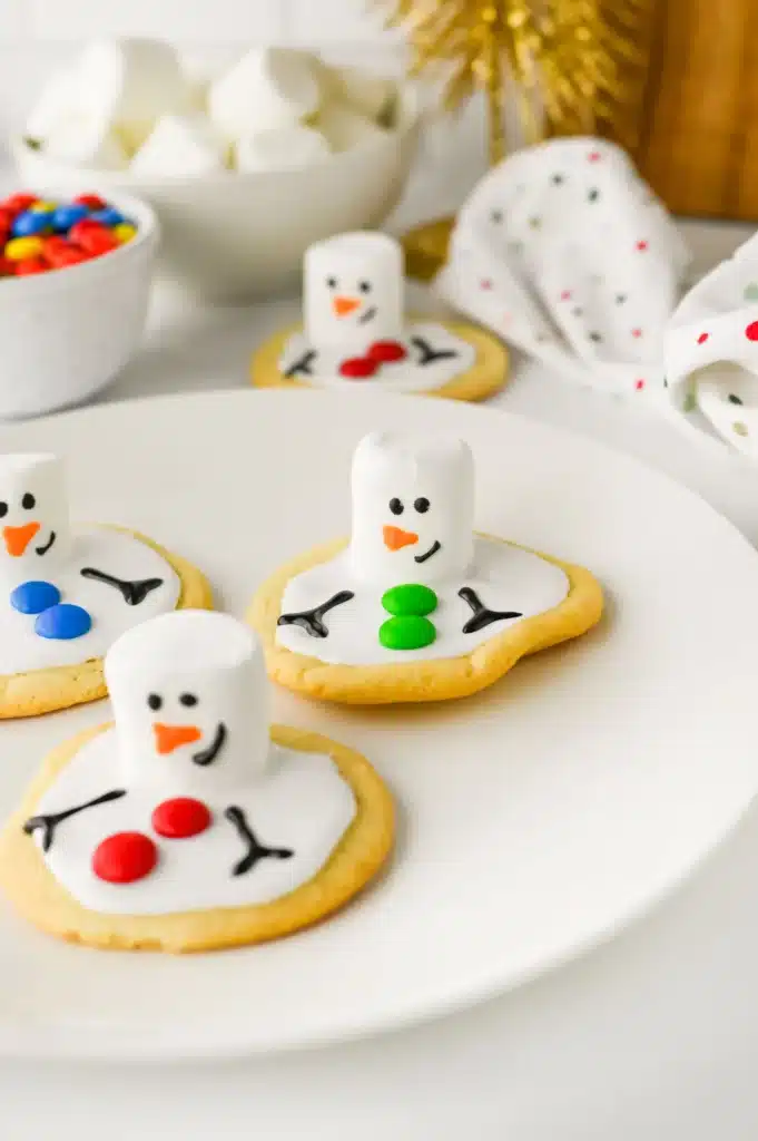 Melted Snowman Cookies - Cultivating Brilliant Minds cookies decorated to look like melted snowmen