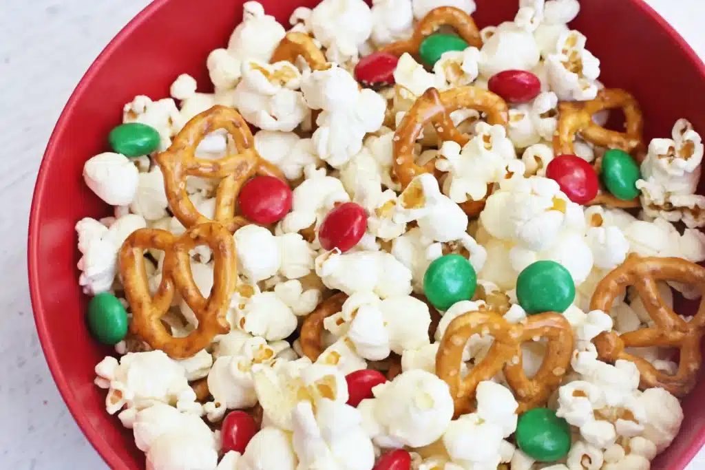 Rudolph Popcorn Snack Mix - Cultivating Brilliant Minds rudolph popcorn mix with pretzels and m&ms in a bowl