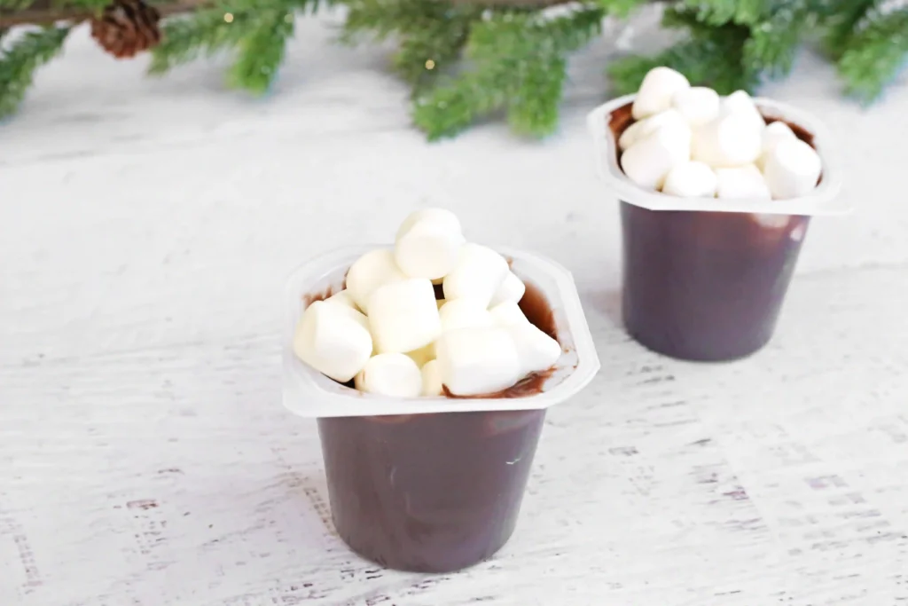 Santa in the Chimney Pudding Snack - Cultivating Brilliant Minds marshmallows in a pudding cup