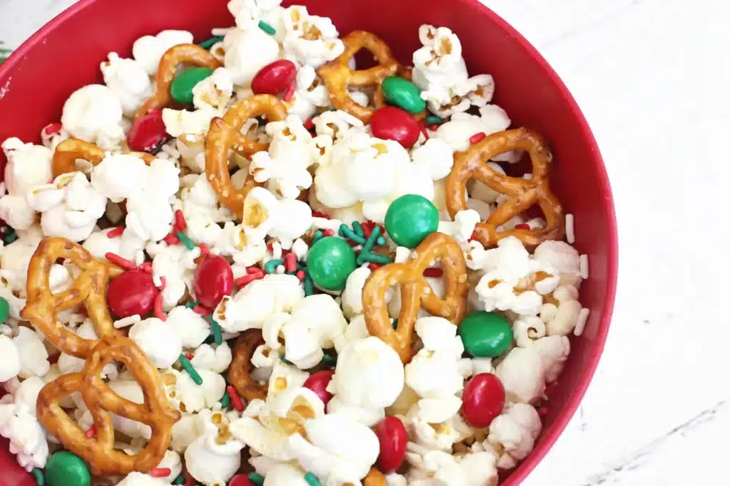 Rudolph Popcorn Snack Mix - Cultivating Brilliant Minds rudolph popcorn snack mix with pretzels and m&ms in a bowl