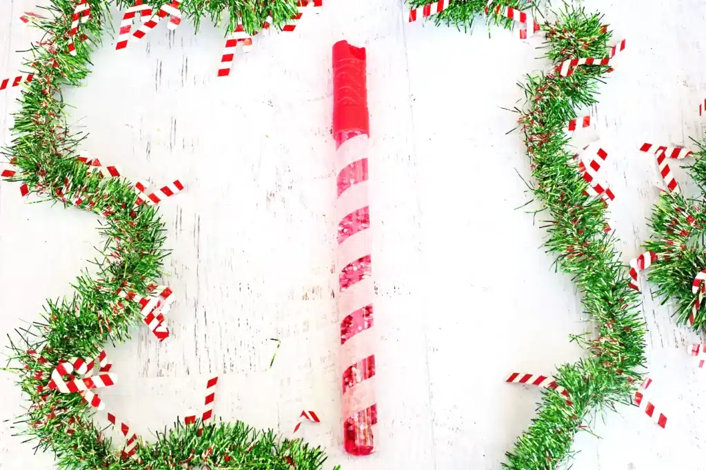 Candy Cane Sensory Wand - Cultivating Brilliant Minds a bubble wand turned into a candy cane sensory wand with glitter inside