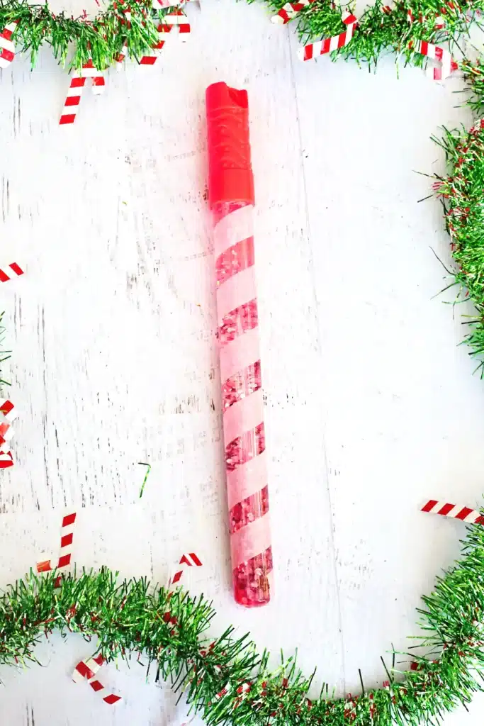 Candy Cane Sensory Wand - Cultivating Brilliant Minds a bubble wand turned into a candy cane sensory wand with glitter inside