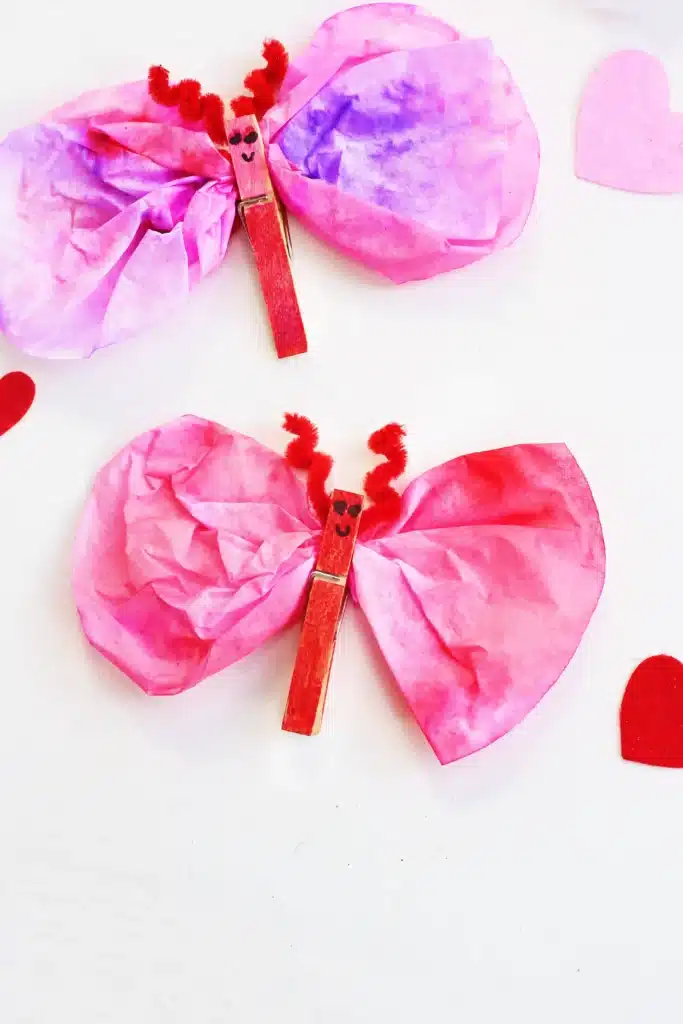 Coffee Filter Valentine Love Bugs - Cultivating Brilliant Minds coffee filter valentine love bug with a clothespin body and pipe cleaner antennae