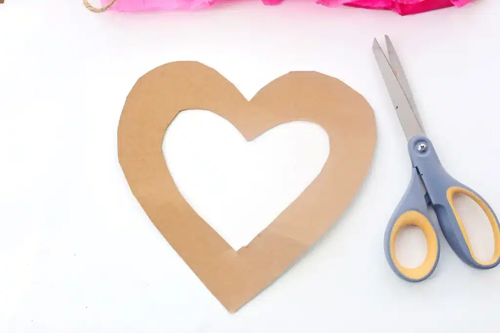 Tissue Paper Heart Wreath - Cultivating Brilliant Minds a heart cut out of cardboard