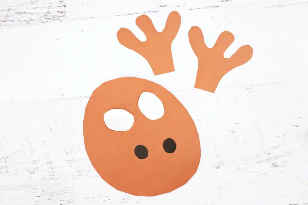 Rudolph Ring Pop Craft - Cultivating Brilliant Minds reindeer face and pieces cut out of construction paper