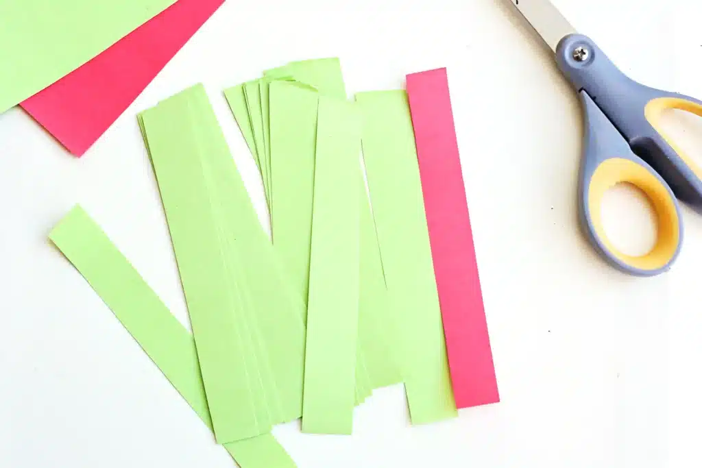 Grinch Paper Chain Countdown - Cultivating Brilliant Minds green and red construction paper cut into strips