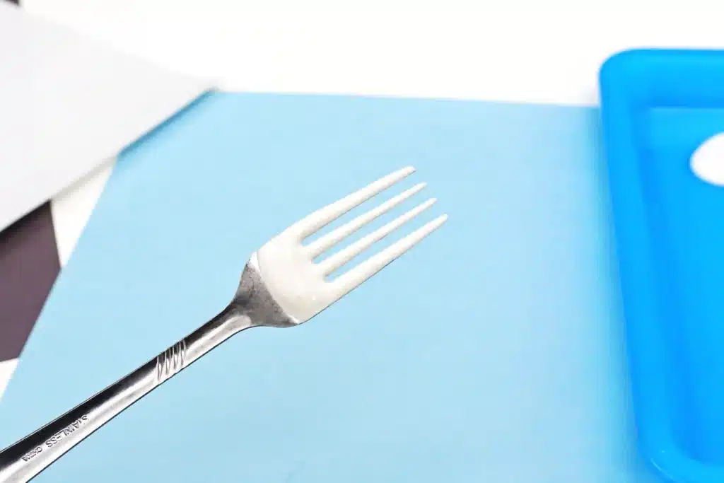 Fork Painted Abominable Snowman - Cultivating Brilliant Minds white paint on a fork