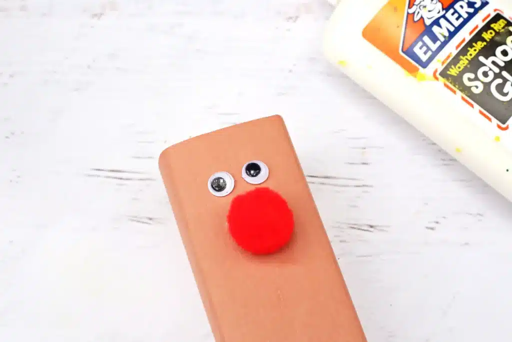 Rudolph Juice Boxes - Cultivating Brilliant Minds juice box wrapped in brown paper with googly eyes and a red nose to create a rudolph juice box