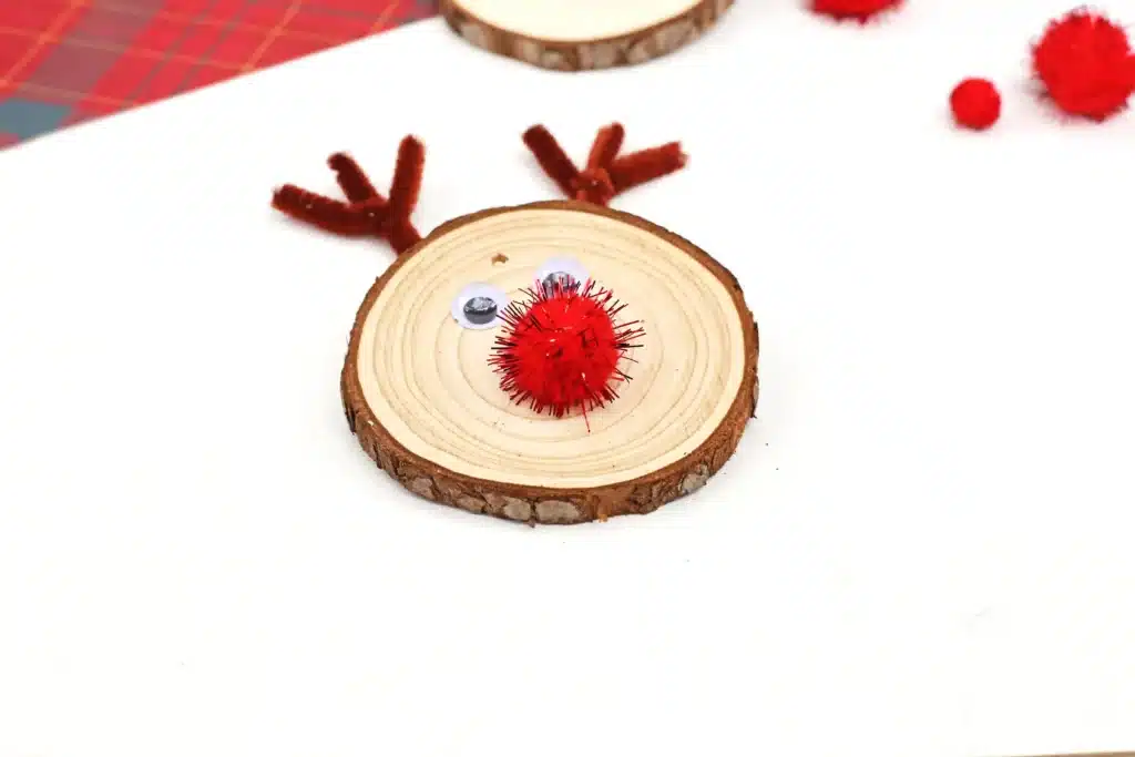 Rudolph Wood Slice Ornament - Cultivating Brilliant Minds a wood slice decorated to look like rudolph and made into an ornament for the tree