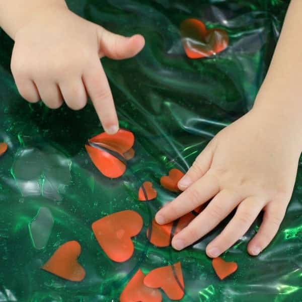 The Best Grinch Crafts and Activities for Kids - Cultivating Brilliant Minds Grinch Heart Sensory Bag