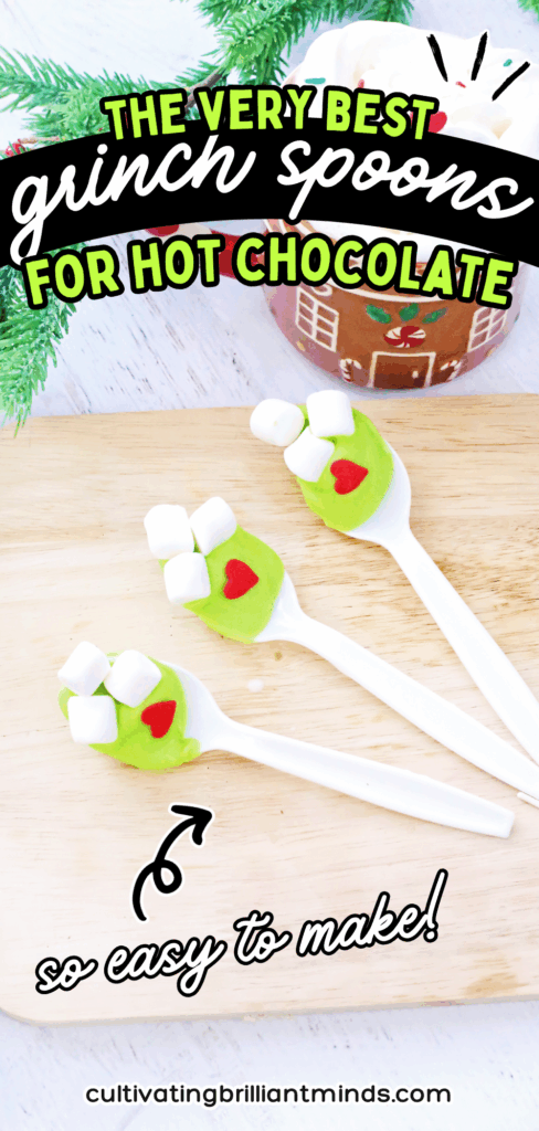 Grinch Hot Chocolate Spoons - Cultivating Brilliant Minds spoons with green-colored white hot chocolate melted on it with mini marshmallows and a red candy heart
