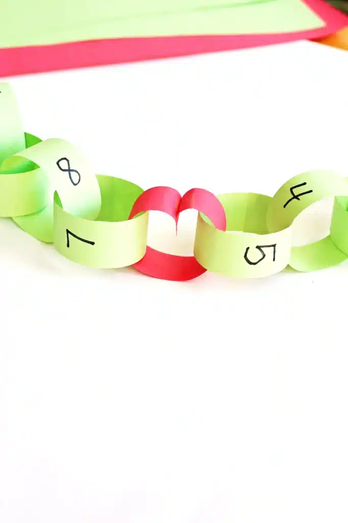 Grinch Paper Chain Countdown - Cultivating Brilliant Minds construction paper made into a paper chain to countdown the days to christmas