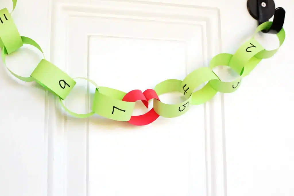 Grinch Paper Chain Countdown - Cultivating Brilliant Minds construction paper made into a paper chain to countdown the days to christmas