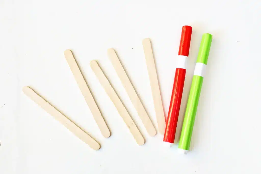 Grinch Popsicle Stick Photo Frame - Cultivating Brilliant Minds popsicle sticks and red and green paint