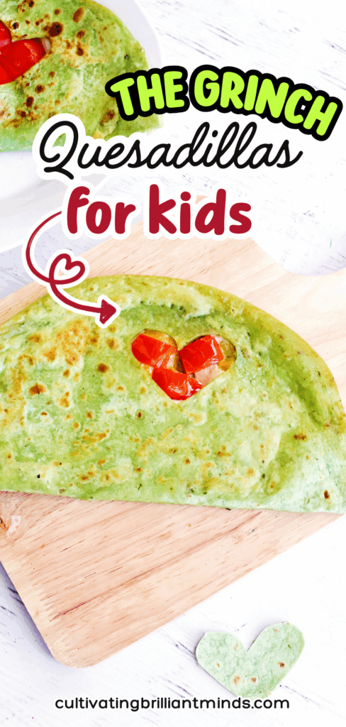Grinch Quesadillas - Cultivating Brilliant Minds a quesadilla with a heart cut out and red peppers inside