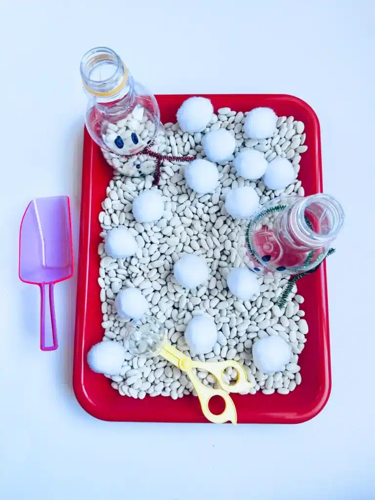 Snowman Sensory Bin - Cultivating Brilliant Minds a snowman sensory bin using beans and cotton balls