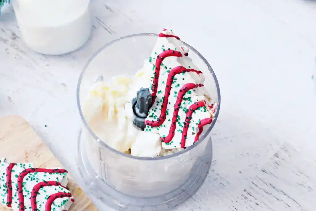 Christmas Tree Cake Milkshake - Cultivating Brilliant Minds vanilla ice cream, milk, and a little debbie christmas tree in a blender