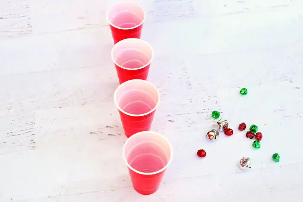 Jingle Bell Toss Reindeer Game - Cultivating Brilliant Minds red cups with multicolored jingle bells